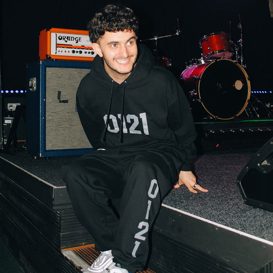 Model wears Brumbox's black 0121 tracksuit