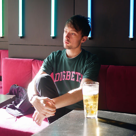 Digbeth Tee Pink chest print on jade T-shirt.