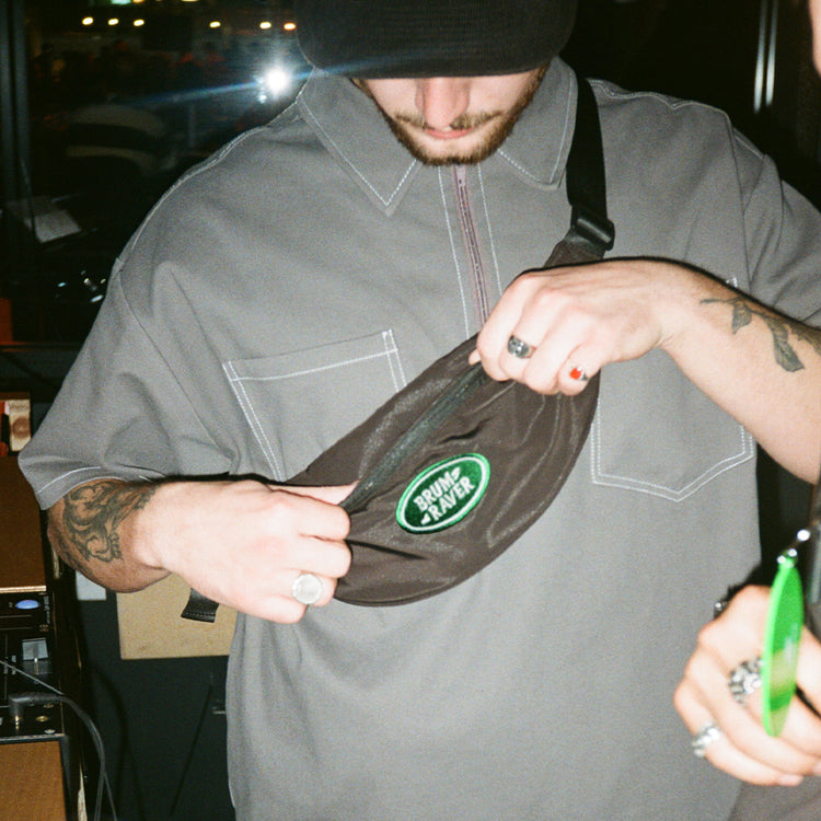 Model wears Brumbox's Brum Raver embroidered bumbag in black