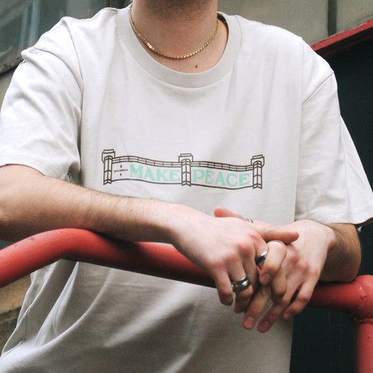 Photograph of a man wearing the Brumbox G A Makepeace T-shirt in bone colour (front)