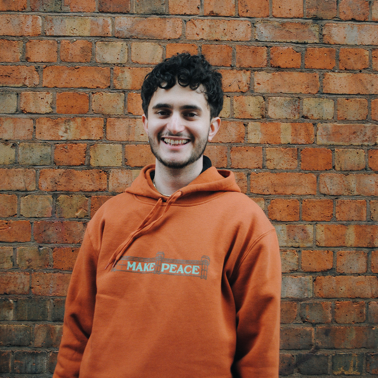 Photograph of a man wearing the Brumbox G A Makepeace Hoody in copper (front)