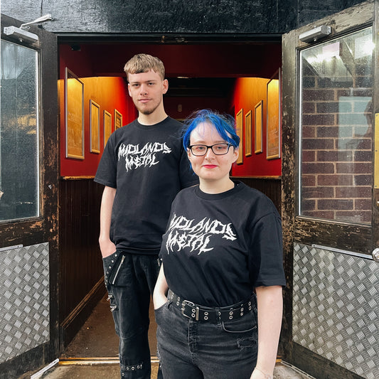 Brumbox's Midlands Metal black T-shirt, celebrating the metal music scene in Birmingham. Modelled by a member of Subside Staff and a customer