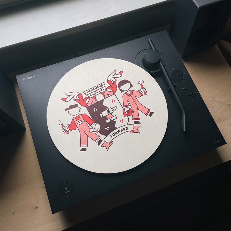 Brumbox red Birmingham crest illustration on a cream vinyl slipmat on record player