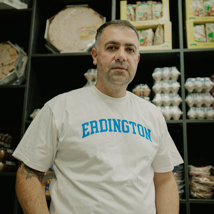 Auder wearing the Brumbox vintage athletic style Erdington white T-shirt while working in Erdington Stores