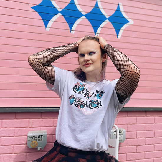 Model wears Brumbox's Queens Heath Pride 2023 cotton T-shirt outside The Juke in Kings Heath