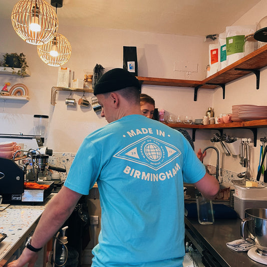 Brumbox Made in Birmingham, workshop of the world T-shirt in diamond mint (back) worn by Rory from Pause Coffee shop & Bakery