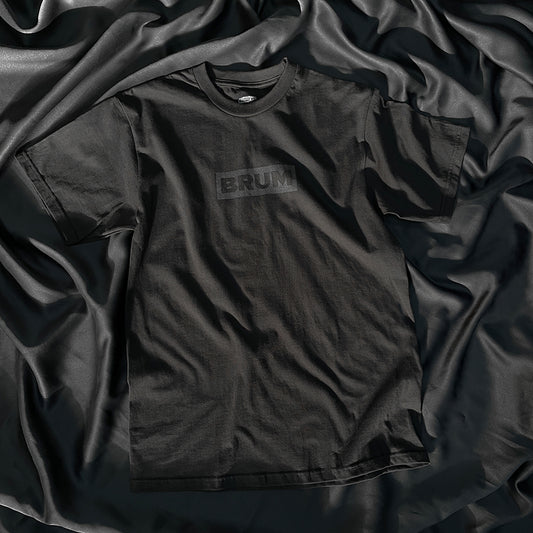 Brumbox Brum logo in black on a black t-shirt (front)